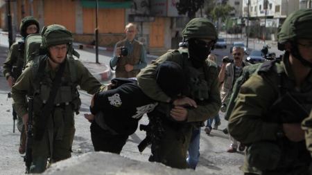 Two Palestinian political prisoners complete 18 years behind bars