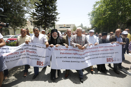 Palestinians demonstrate against the German parliament decision on BDS