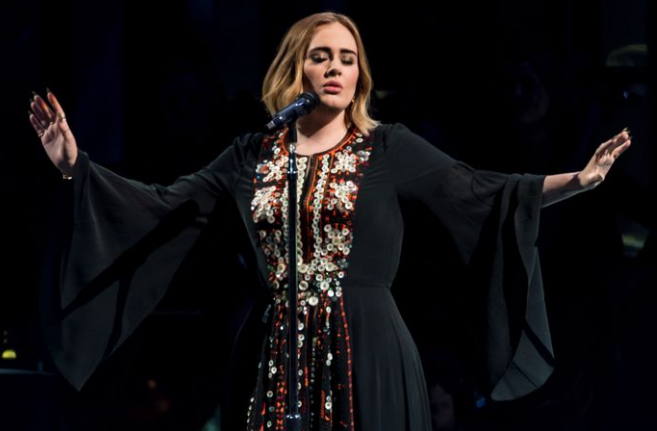 Adele wears 2016 Glastonbury dress while watching her presentation at home