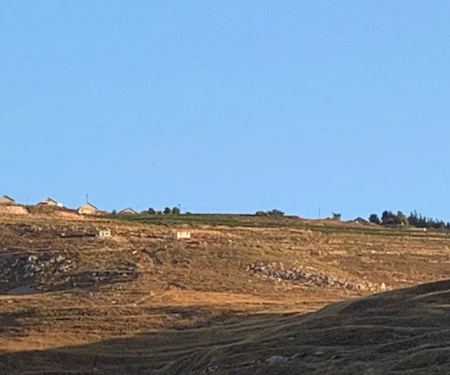 In an effort to block Israeli settlers from taking over land near a water well, Palestinians clash with soldiers