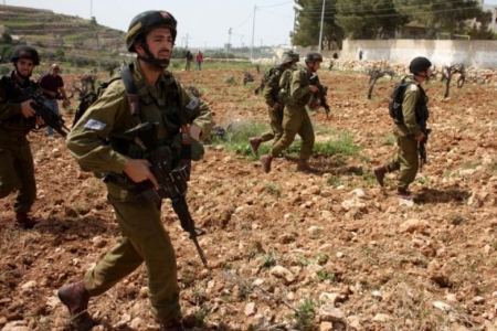 Israeli soldiers beat an elderly Palestinian man for refusing to leave his West Bank land